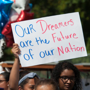 A DACA supporter holds a sign at a rally in Washington DC