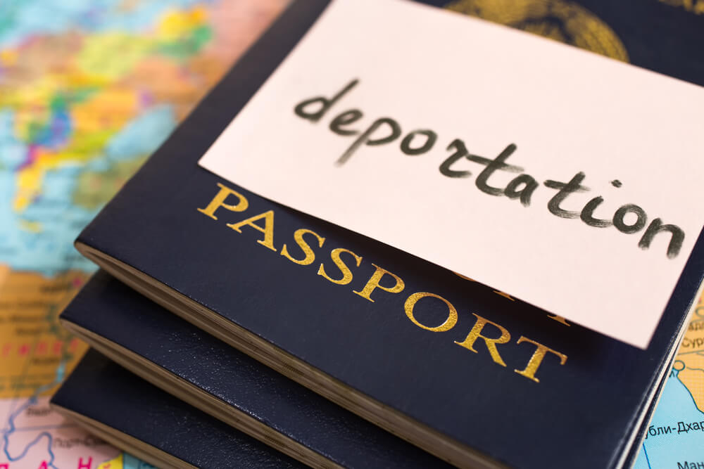 Passport on map. inscription deportation