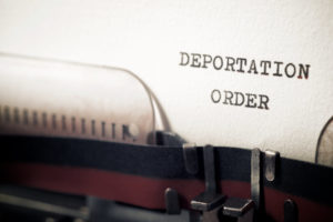 Deportation order phrase written with a typewriter.