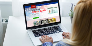 woman with laptop Permanent resident card Green card of USA