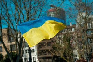 ukranian flag on a pole over beautiful sky