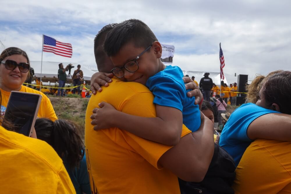 Families separated by immigration policies embrace for 3 minutes at Mexico-U.S. border.